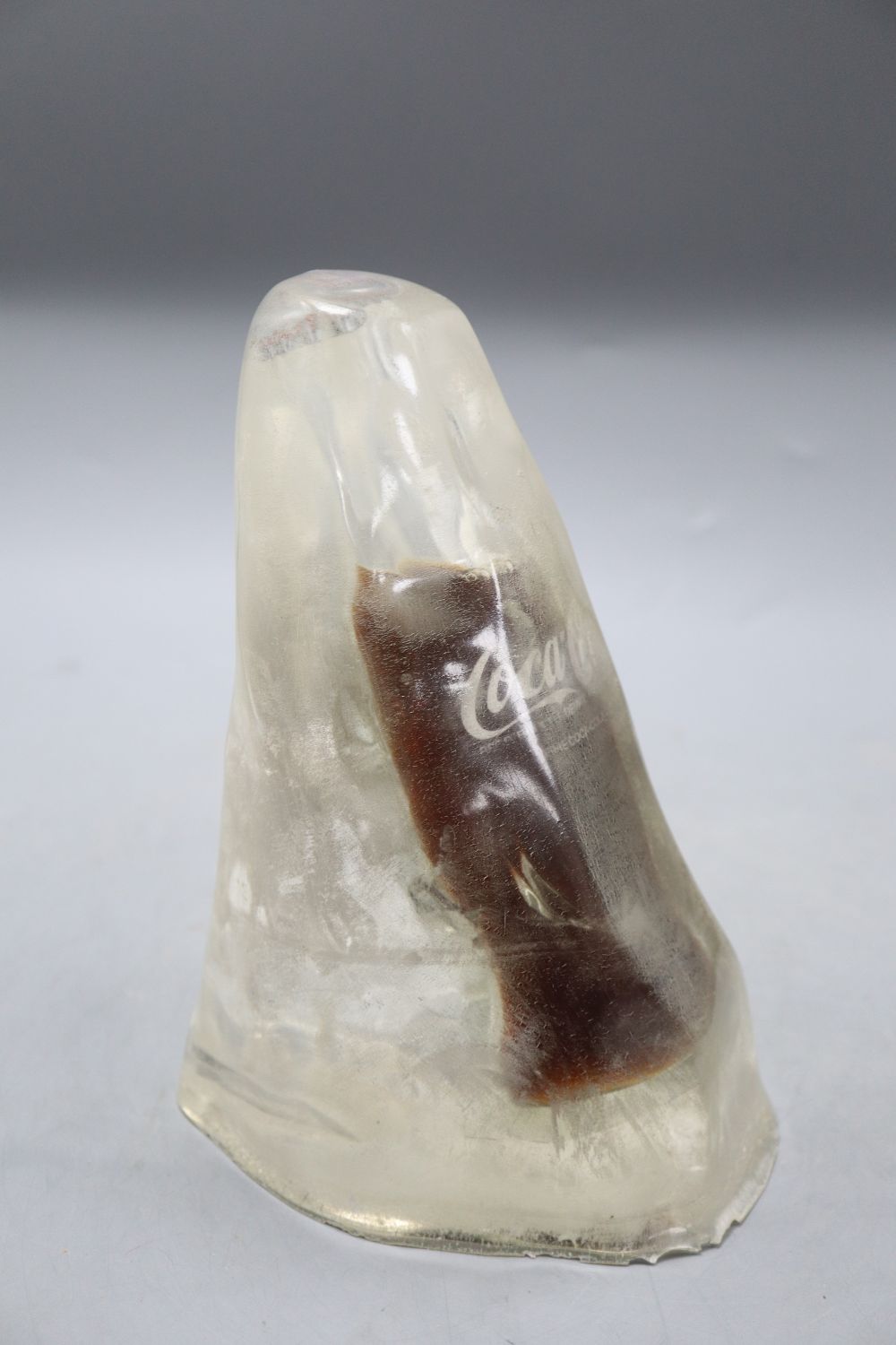 A novelty Coke bottle in ice, height 21cm